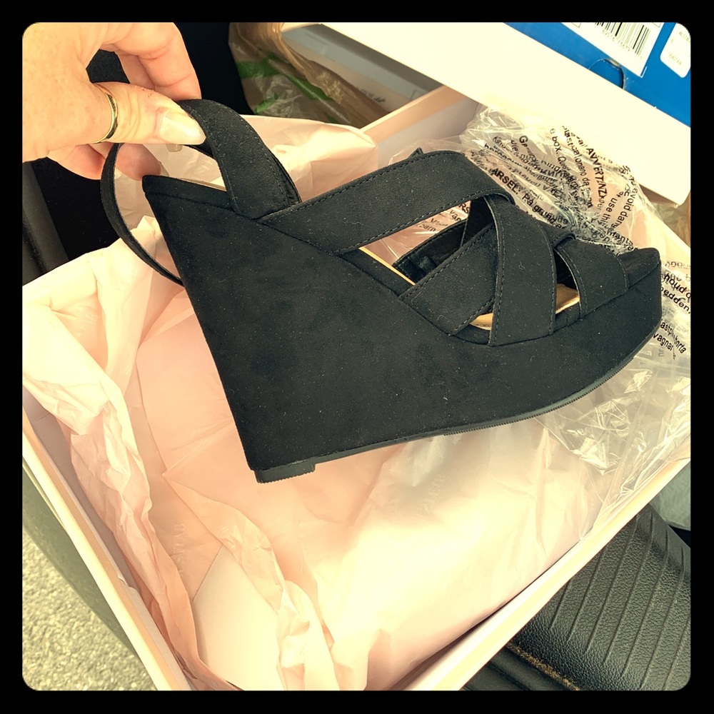 Brand new pair of  wedge sandals.